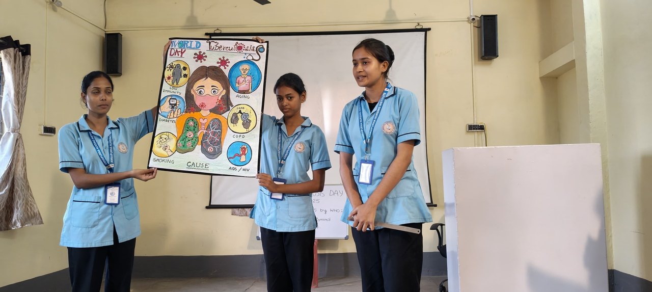 GNM students presenting a health education poster in the lecture room