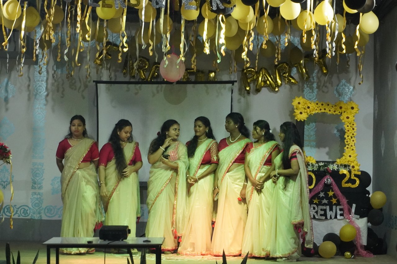 Students on the decorated stage at an institute celebration