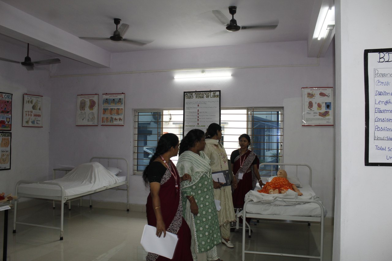Midwifery and maternity nursing lab with demonstration beds and manikins