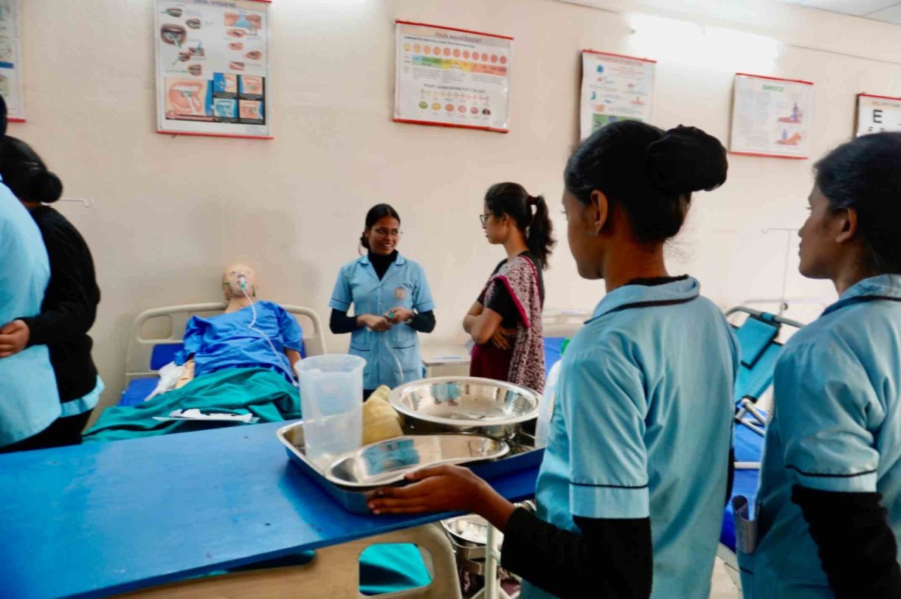 GNM students practising a nursing procedure on a manikin