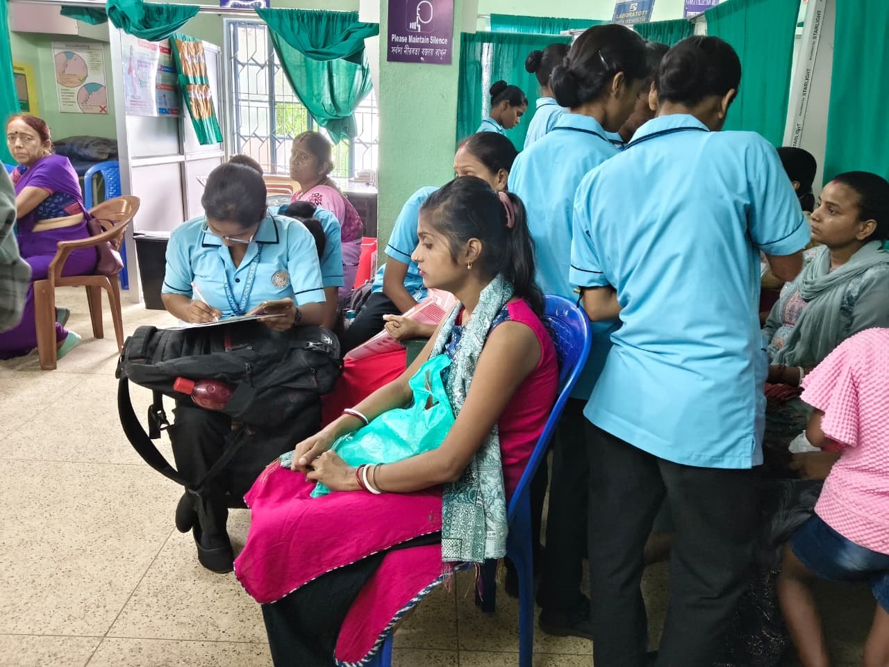 GNM students assisting at a community health camp